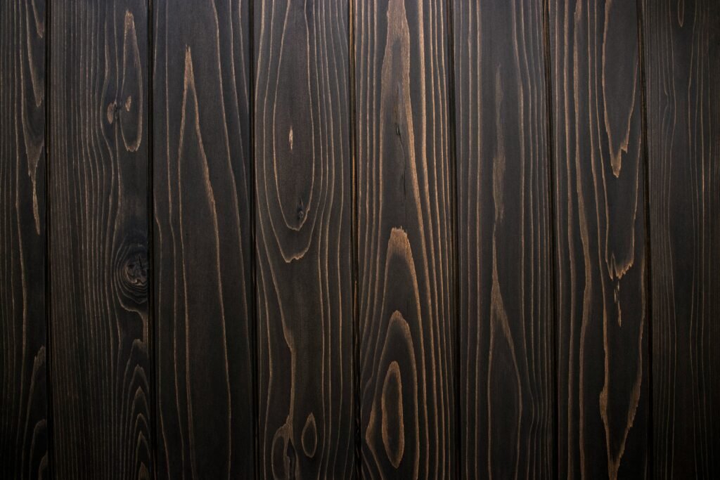 Close-up of ebonized wood with a deep black finish.