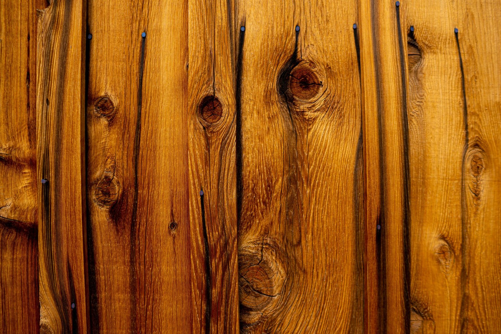 Wood furniture being stained during the finishing process.